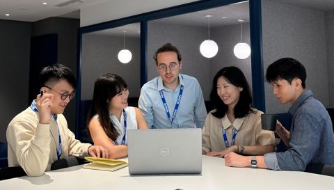 Group Looking At Laptop